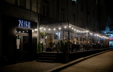 Zmist - cozy outdoor dining terrace with comfortable seating and lighting