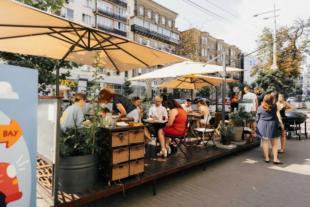 Spacious Budynok Dyva terrace with flowers and seating areas