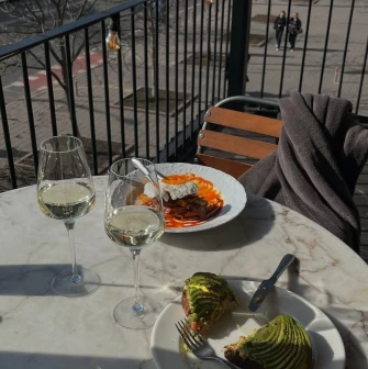 Shalom - large open-air summer terrace with tables set for dining