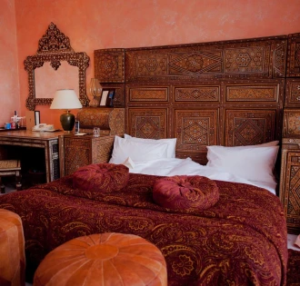 Opera Hotel - luxurious king-sized bed with rich fabrics