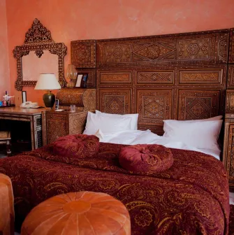 Opera Hotel - luxurious king-sized bed with rich fabrics