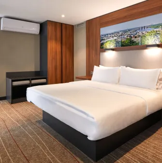 Bedroom in Sky Loft Hotel Kyiv by Rixwell