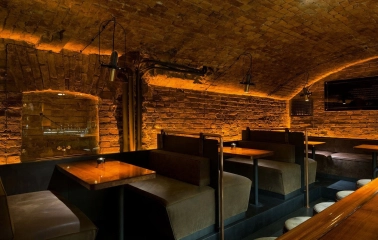 Loggerhead - dimly lit tables with candles, showcasing the intimate atmosphere