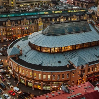 Night view of Bessarabian Market from above a busy intersection in the center of Kyiv