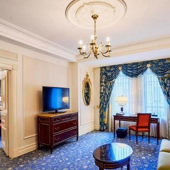 Fairmont Grand - elegant hotel room with classic furniture and rich textiles