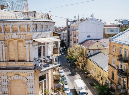 Vulytsia Reitarska in Kyiv - sunny view from a balcony overlooking a cozy street and old courtyards
