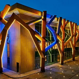 The building of the CEC “Parkovy” in Kyiv with night illumination on the facade