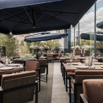 Catch Seafood Restaurant - summer terrace with umbrellas and soft sofas