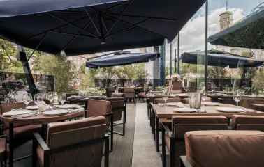 Catch Seafood Restaurant - summer terrace with umbrellas and soft sofas