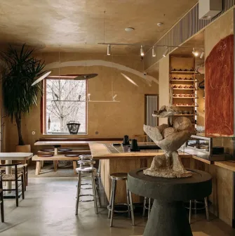 One Tea Tree - minimalist wooden interior with low seating, peaceful atmosphere