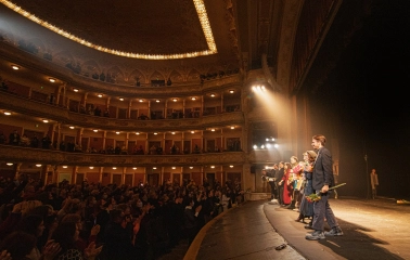 Teatr Franka in Kyiv - warmly lit stage scene with actors lining up after a performance