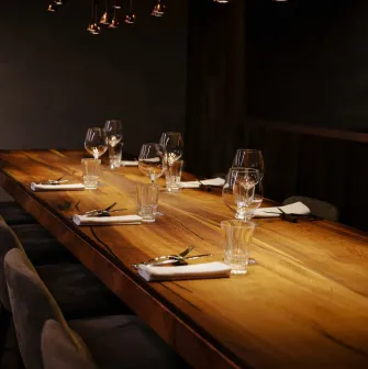 Chef's table - elegant interior, table with wine glasses