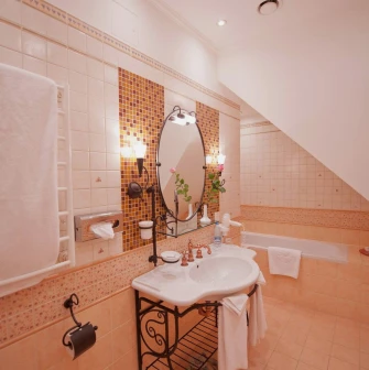 Opera Hotel - lavish marble bathroom with a large bathtub