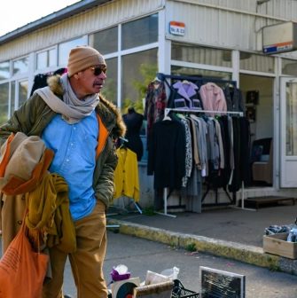 Looking at things at a street flea market near Pochaina station in Kyiv