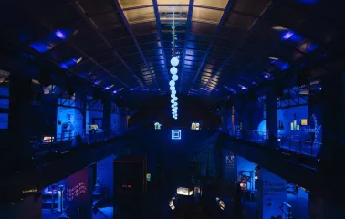 Science Museum at night with blue lighting and installations
