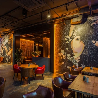 Favor Park Hotel - well-lit interior hall with seating and modern design