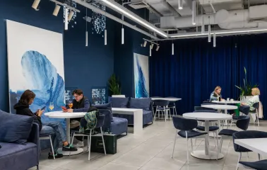 Egersund - brightly lit dining hall with spacious tables and overhead lamps
