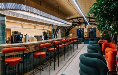 Creative States - long bar counter with high chairs in a lounge area